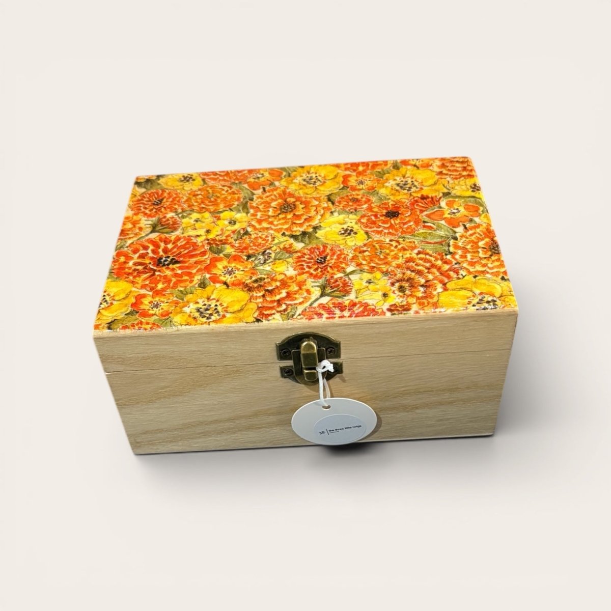 Wooden box with floral pattern on a white background