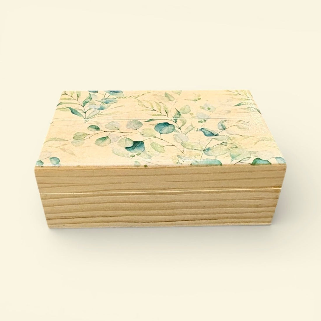 Wooden box with floral pattern on a white background