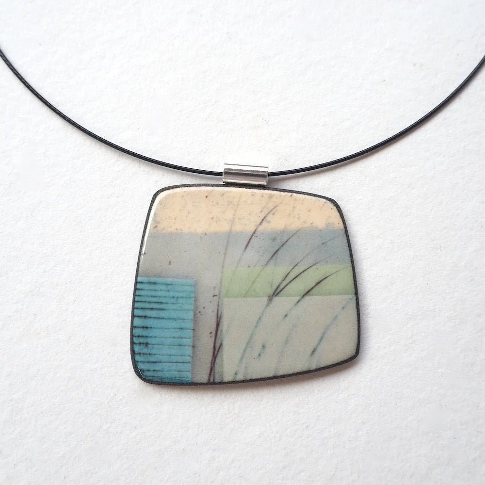 Necklace with a square pendant featuring a natural pattern on a white background