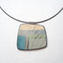 Necklace with a square pendant featuring a natural pattern on a white background