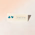 Turquoise heart-shaped earrings on a &