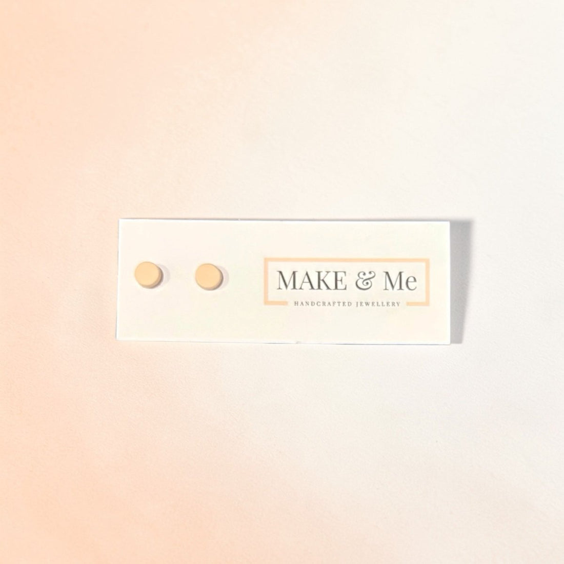 Make &amp; Me earrings on a gradient background