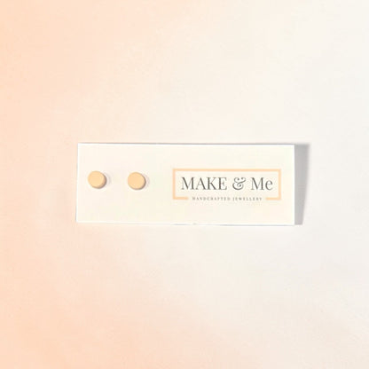 Make &amp; Me earrings on a gradient background