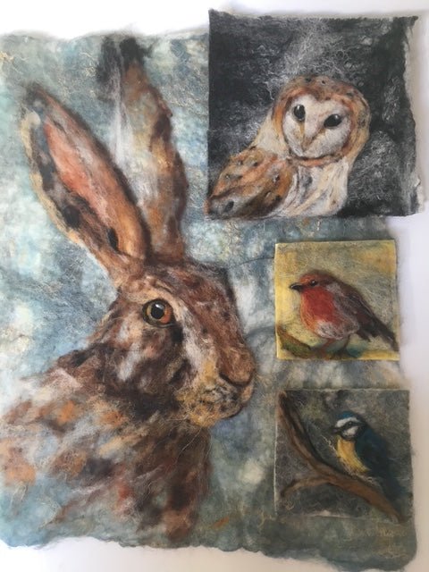 Artistic depiction of a hare with smaller animal portraits on a felted background