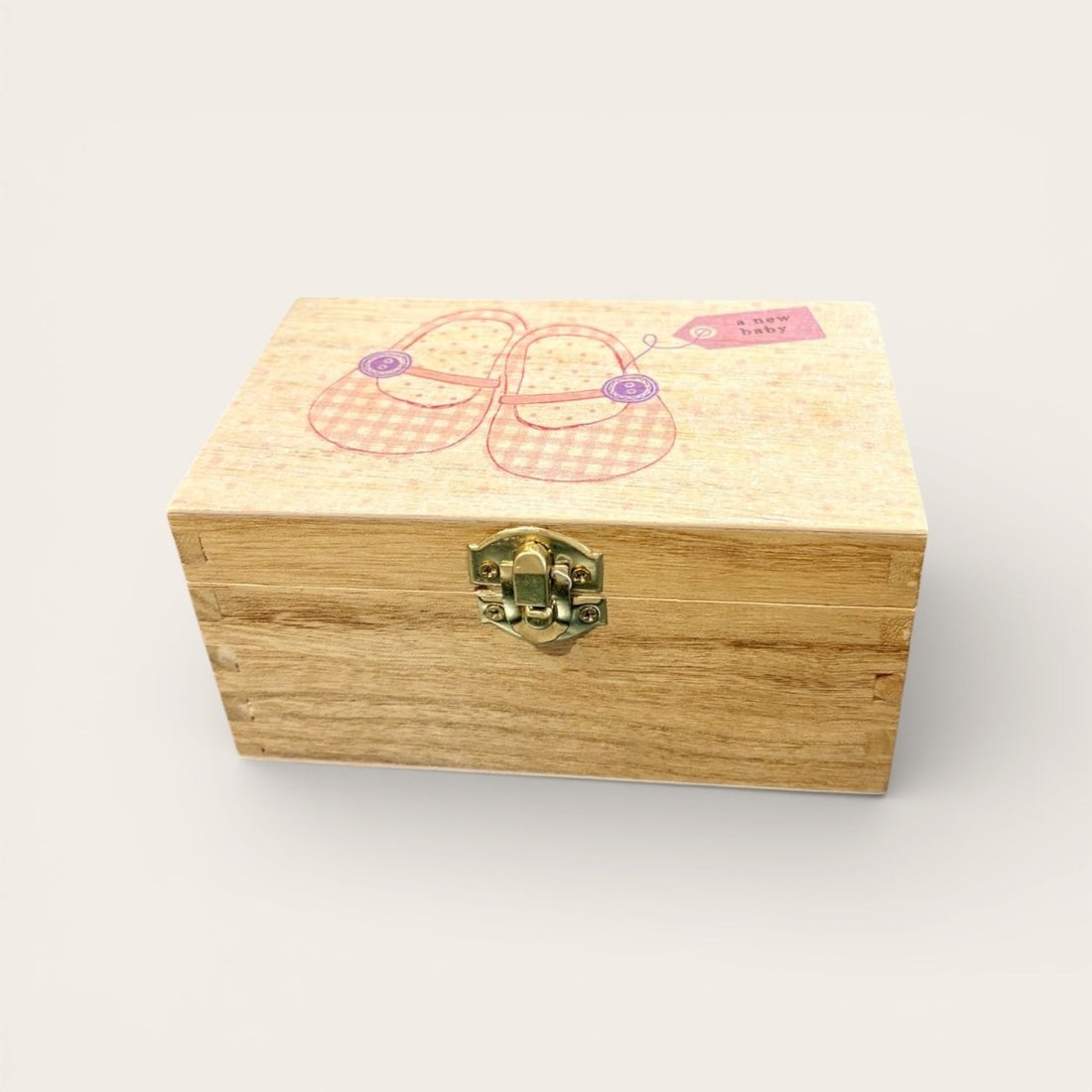 Wooden box with a gold clasp on a white background