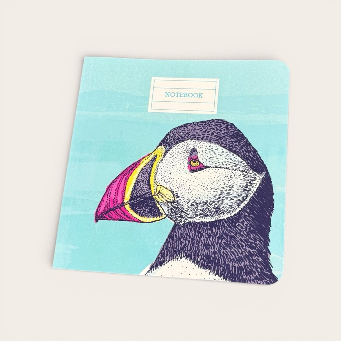 Notebook with a puffin illustration on a light blue background
