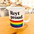 A white ceramic mug with the text &