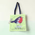 Tote bag with a robin design on a light green background