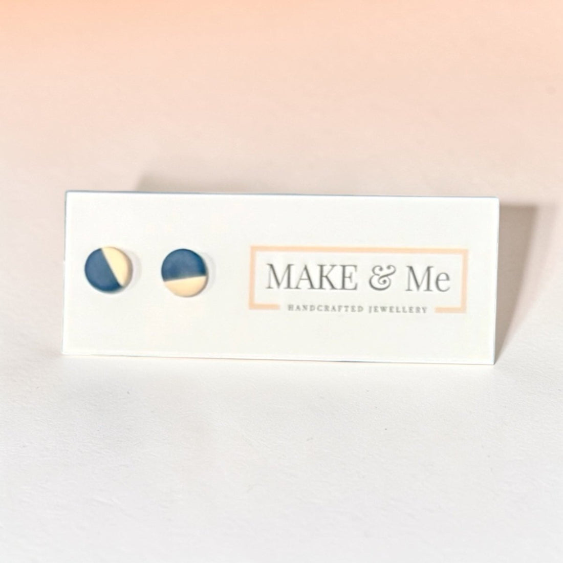 Make &amp; Me jewelry box with two earrings on a light background