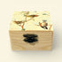 Wooden box with bird illustrations on a beige background