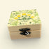Wooden box with floral pattern on a beige background