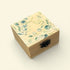 Wooden box with floral design on a beige background