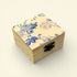 Wooden box with floral design on a beige background