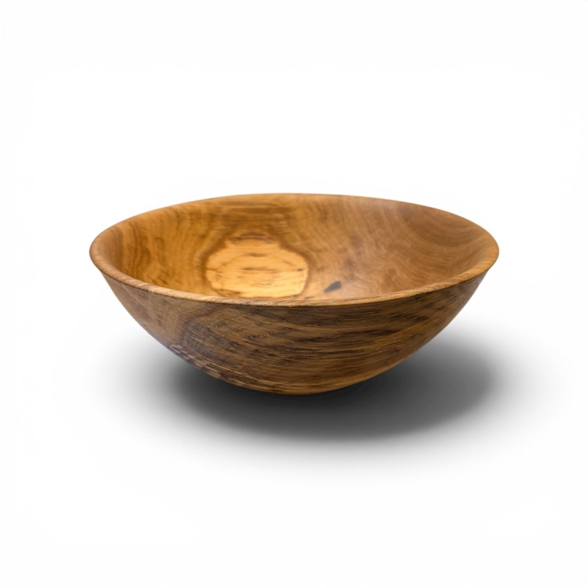 A handcrafted wooden bowl with a rich brown and golden wood grain pattern, shown on a clean white background with a soft shadow underneath.