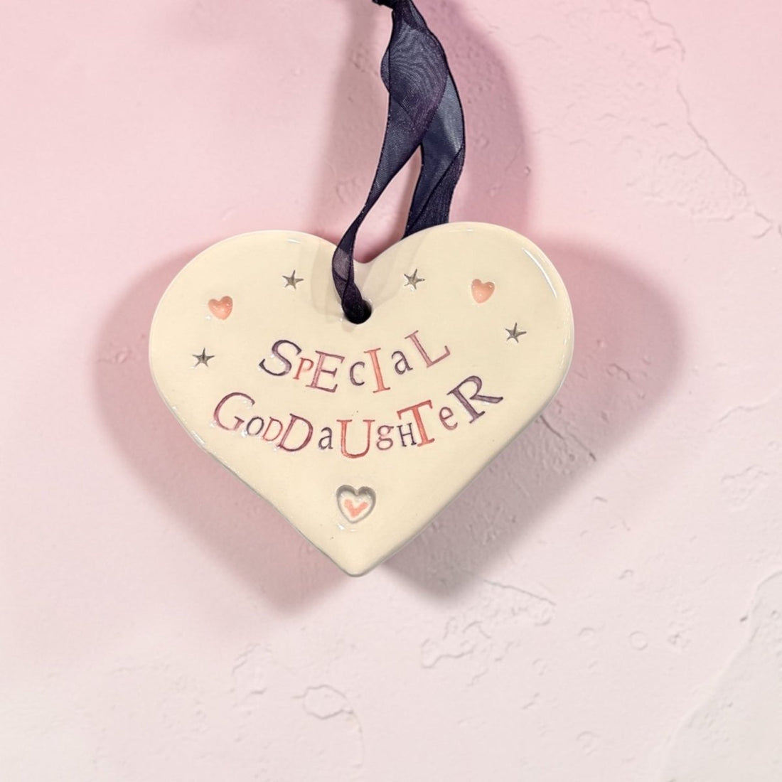 Heart-shaped plaque with &