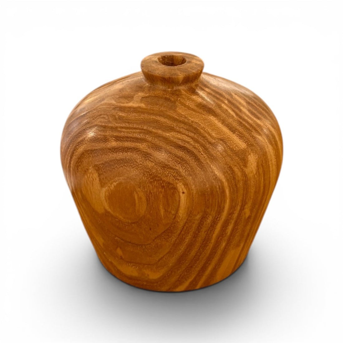 A small rounded wooden vase with a short cylindrical neck and a smooth, polished finish, showcasing natural wood grain patterns, set against a plain white background with a soft shadow.