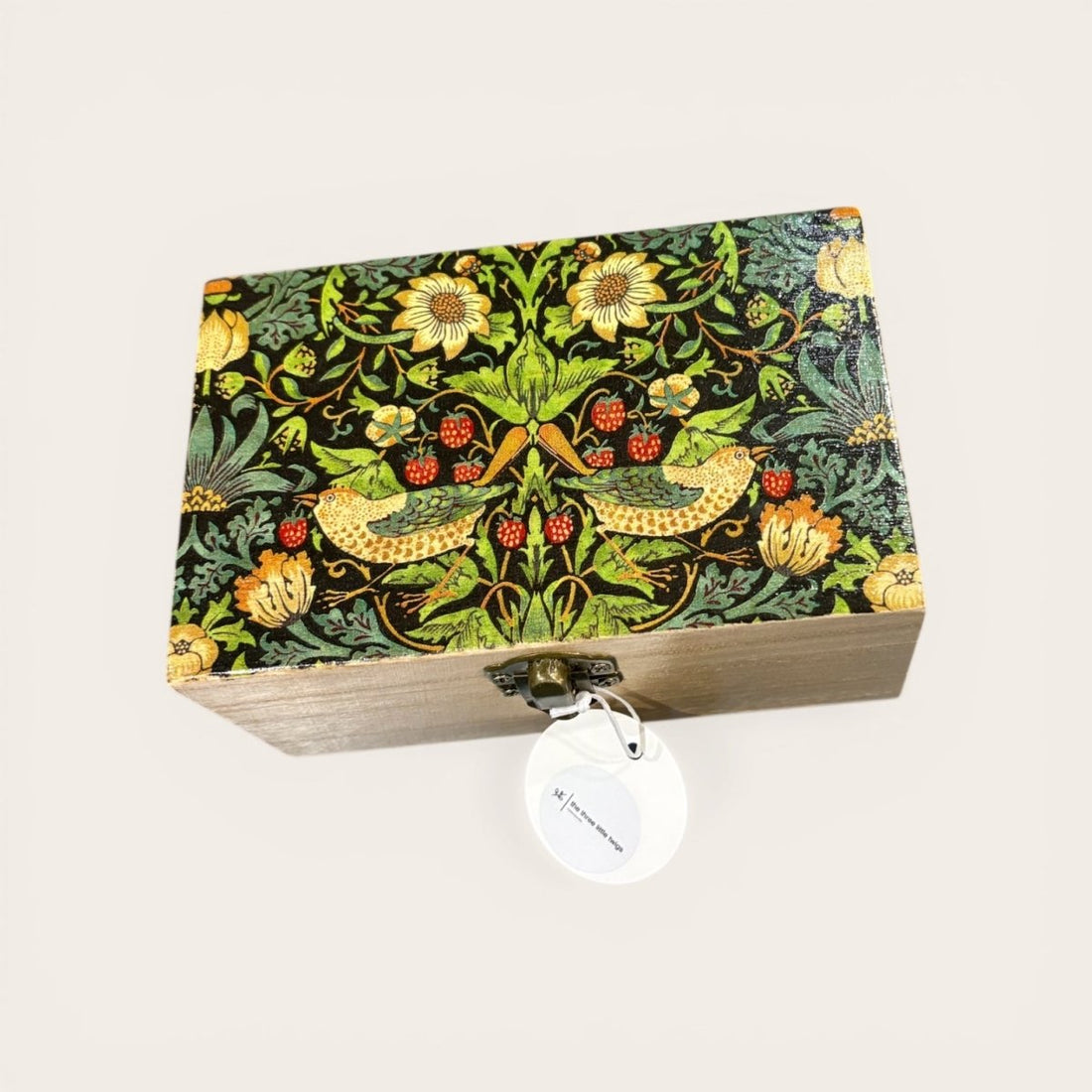 Decorative wooden box with floral pattern on a white background