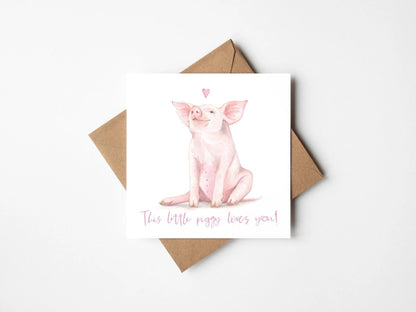Greeting card with a pig illustration and text, accompanied by a brown envelope on a white background.