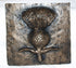 A square bronze wall plaque featuring a raised thistle design with textured metallic surfaces and a rustic finish, photographed against a plain white background.