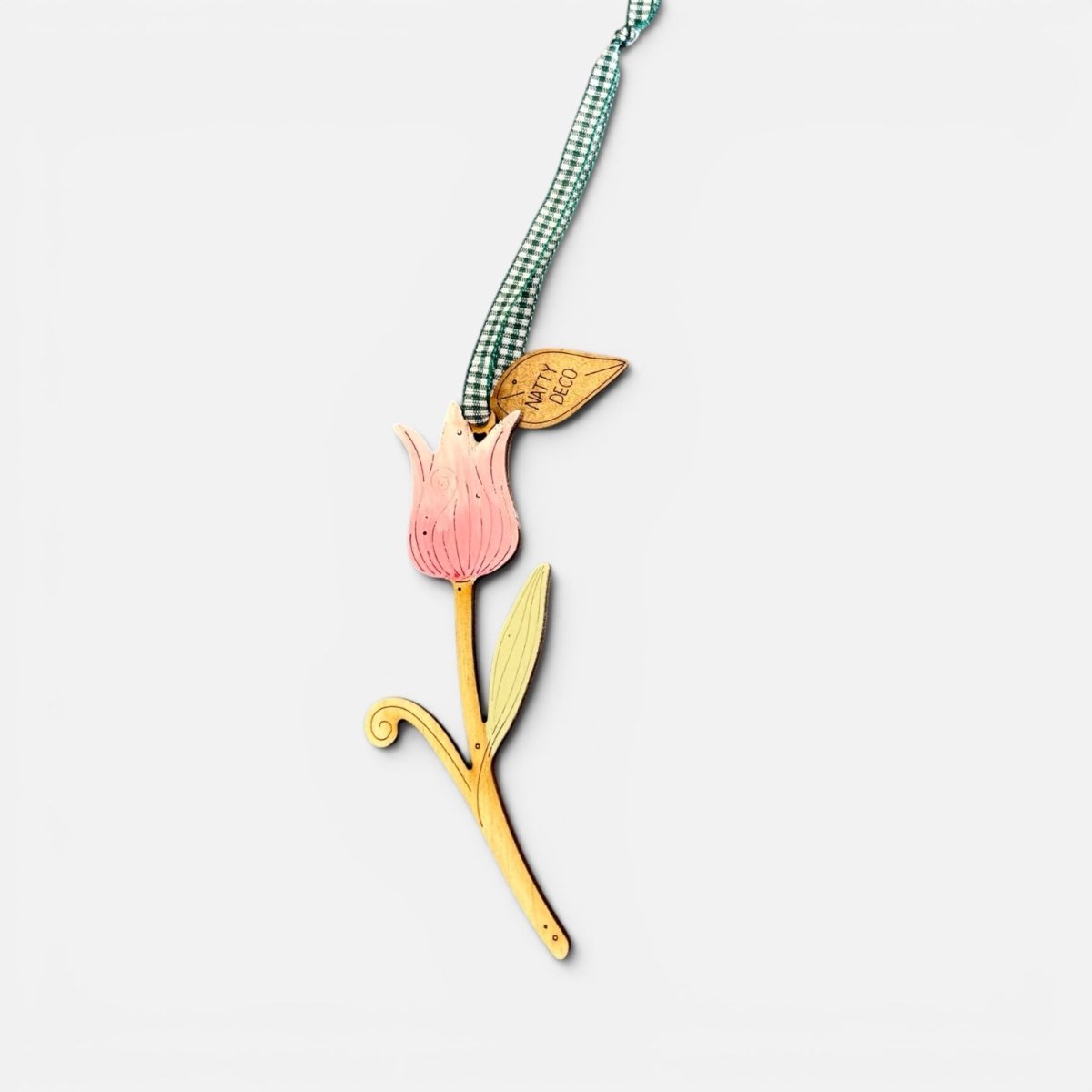 Decorative tulip-shaped wooden bookmark with a checkered ribbon on a white background