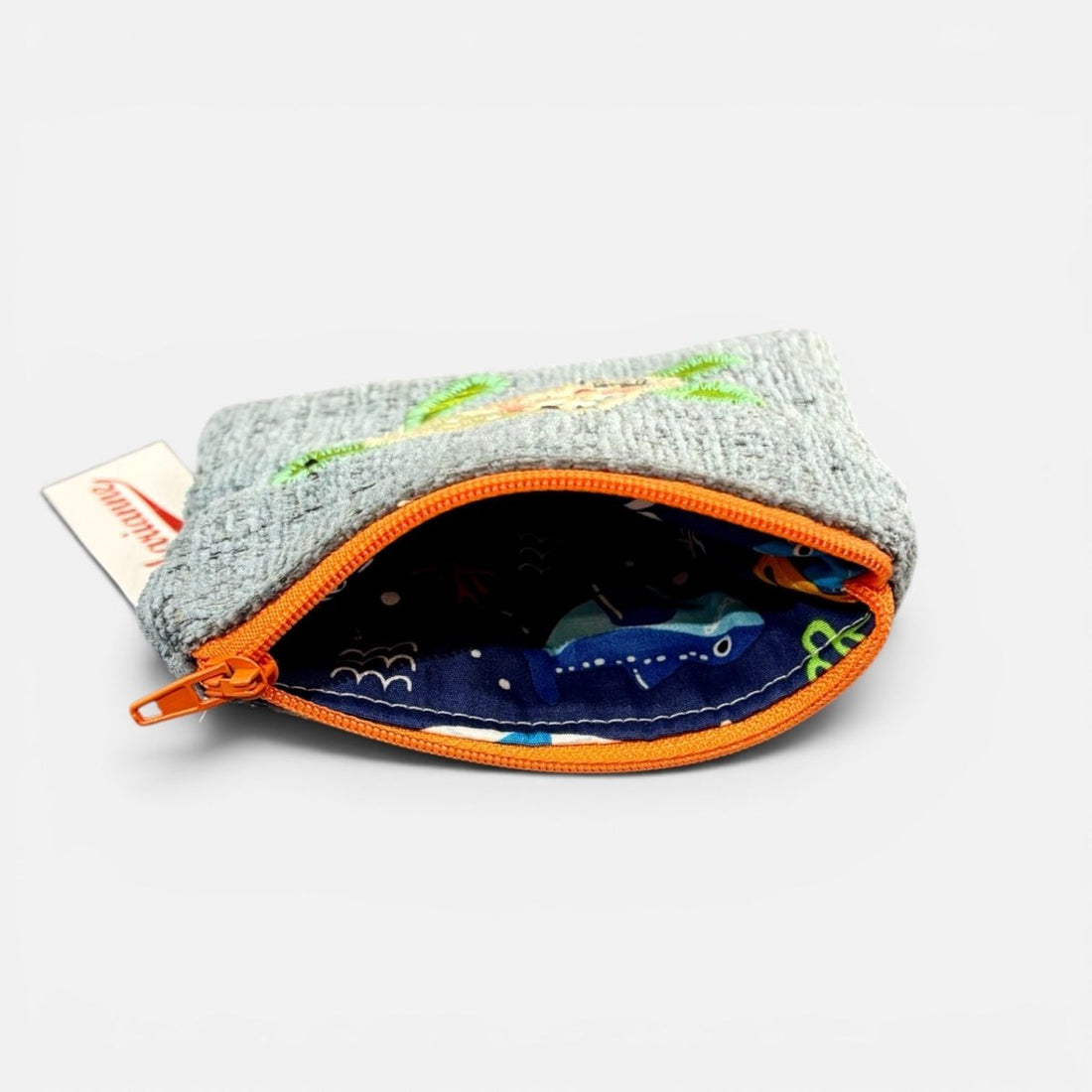 Small pouch with orange zipper on a white background