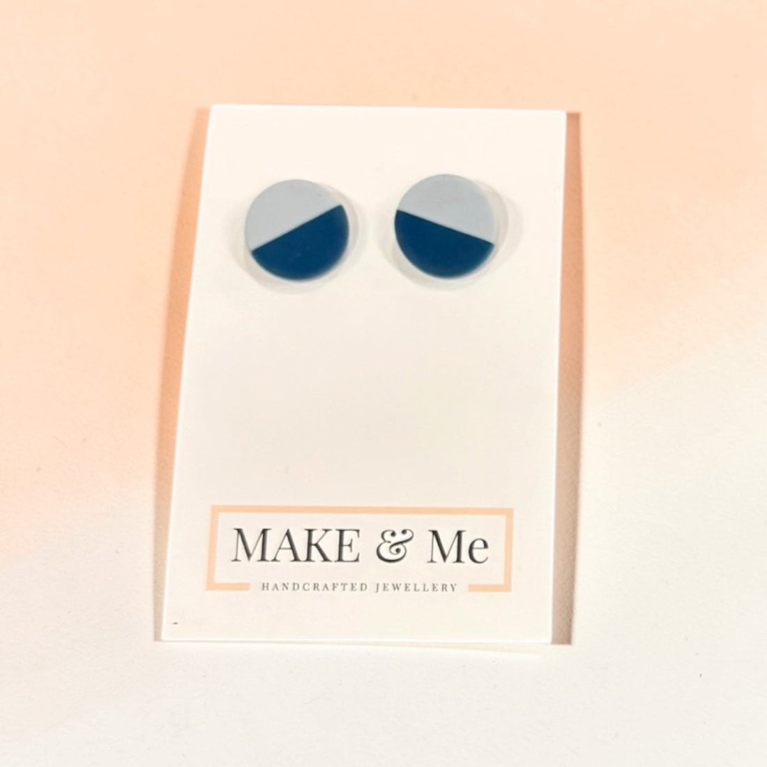 Round earrings with blue and gray color scheme on a &