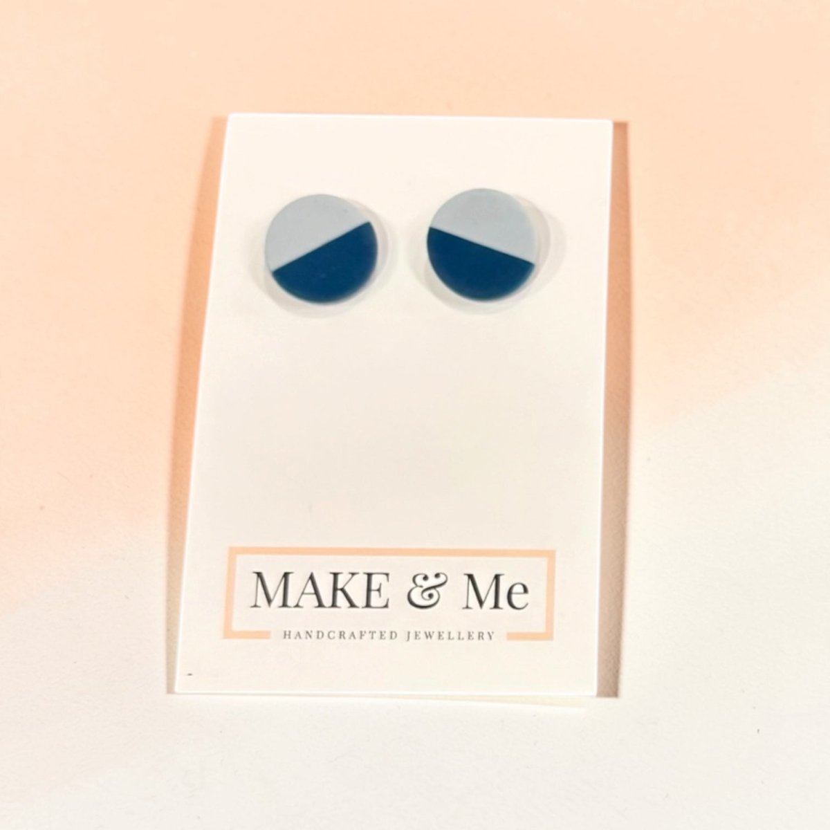Round earrings with blue and gray color scheme on a &