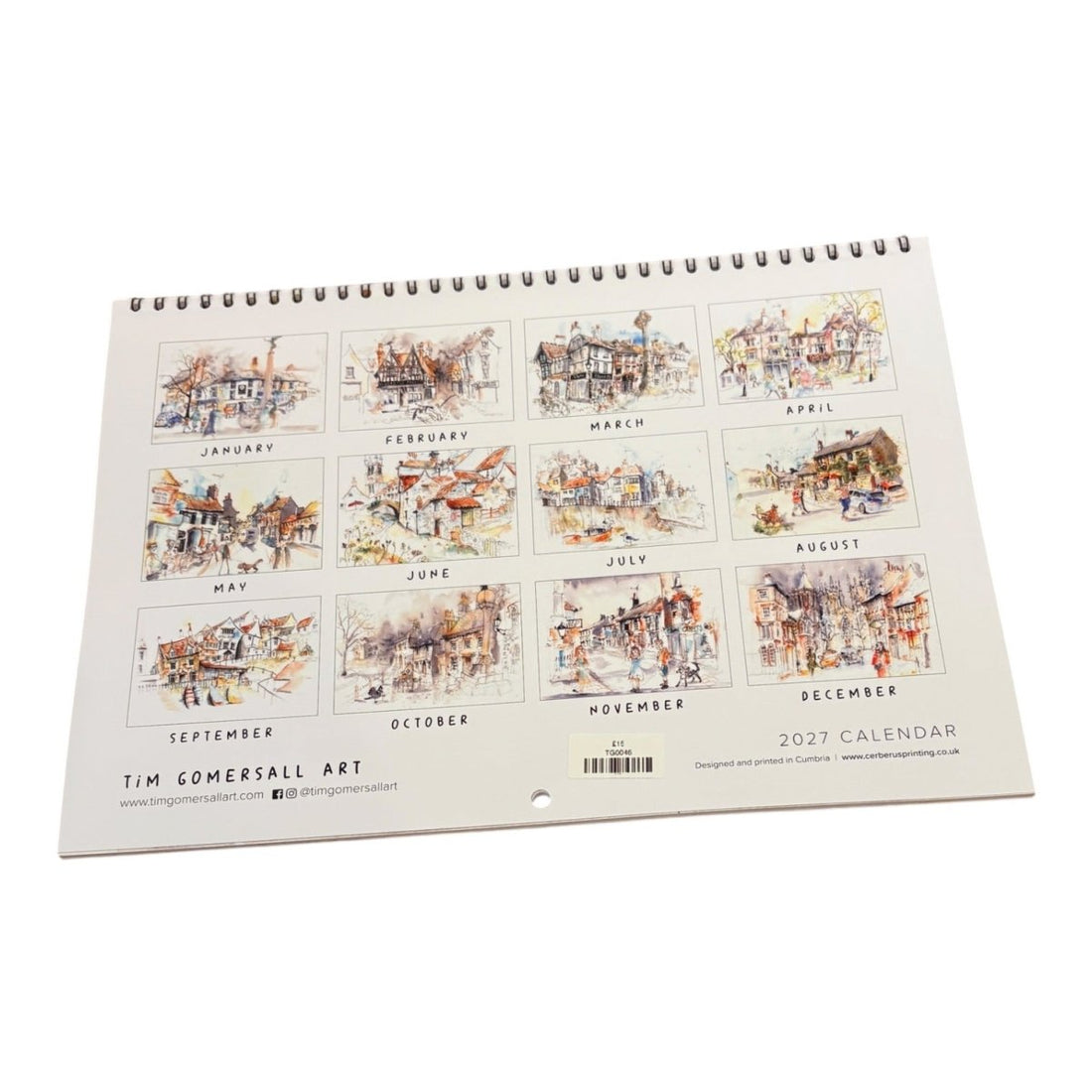 A spiral-bound 2027 wall calendar from Tim Comersall Art, displayed at an angle on a clean white background. The cover features twelve square watercolor illustrations of street scenes, each labeled with its respective month.