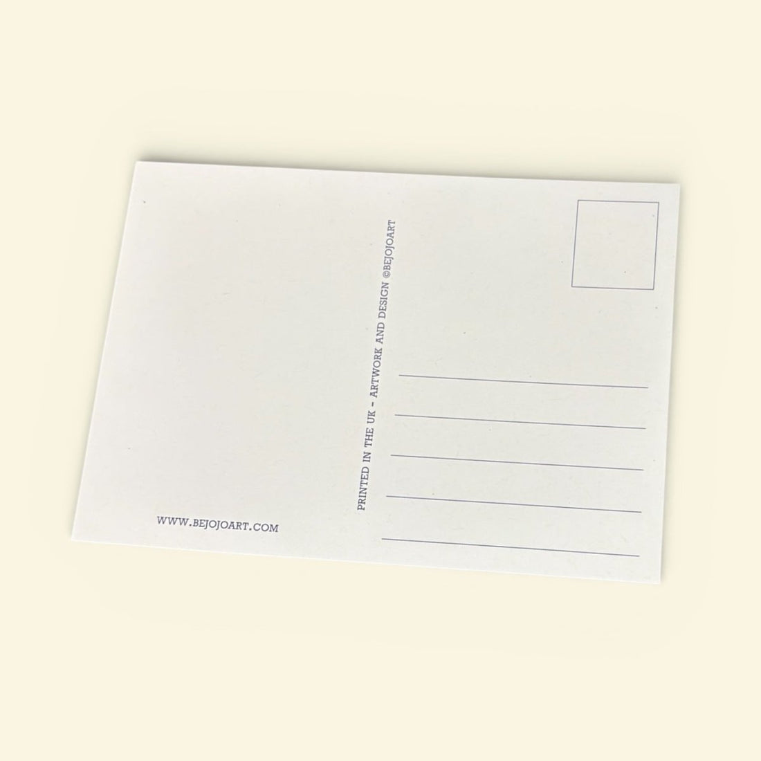 White postcard with text on a beige background